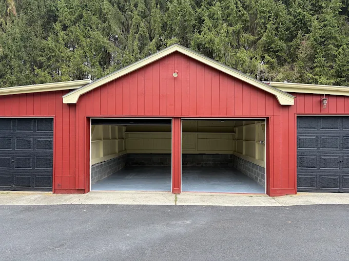 Red painted garage exterior with black garage doors in Hamburg, NJ